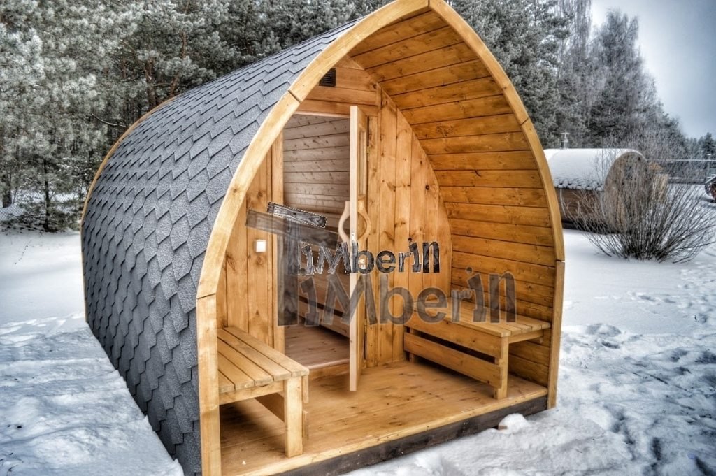 Beautiful outdoor garden sauna Iglu design in winter with panoramic window