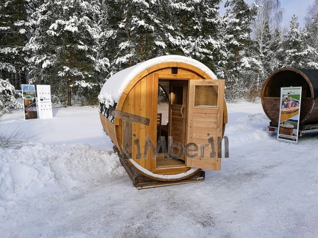Outdoor barrel sauna with full panoramic window in winter (1)