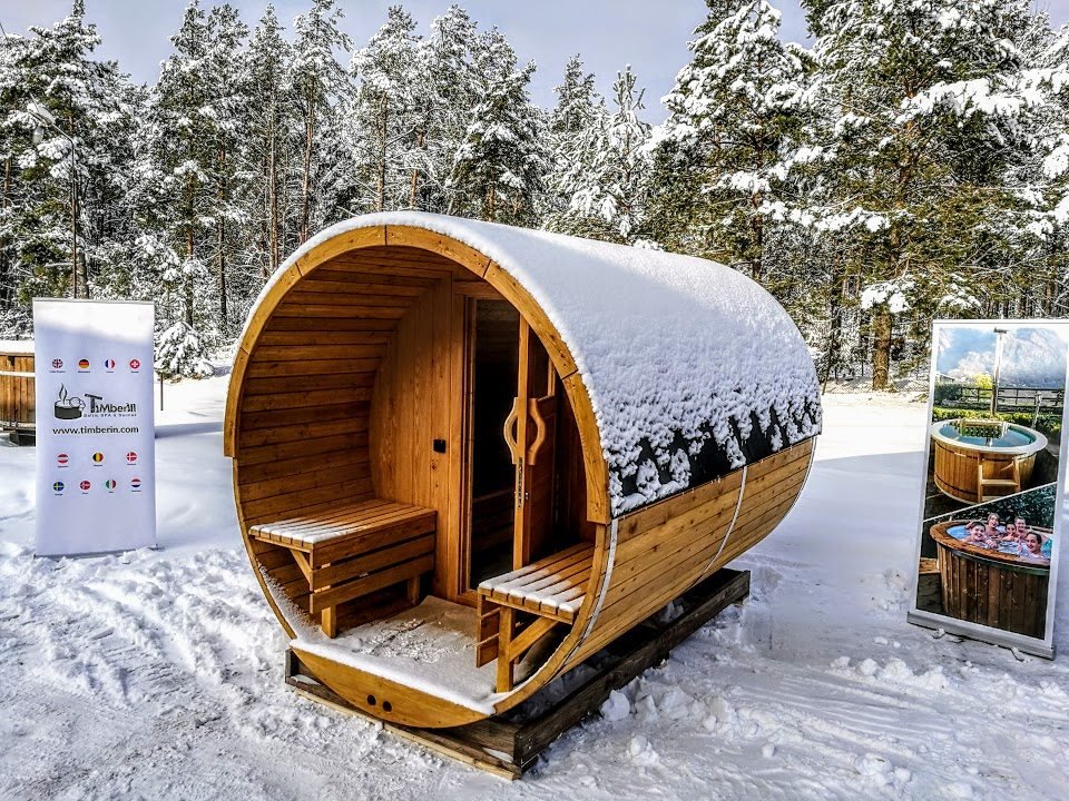 outdoor barrel garden sauna with a porch